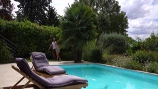 Horny brunette riding a bald stud at the pool