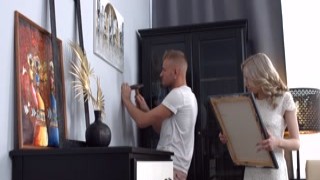 Picture on the wall, blonde in bed is very hot