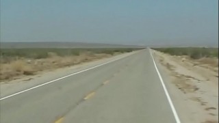 she stands in the dessert and stop a bus - she stand inside the bus and she can t stop what happens