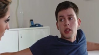 A hot stepmom instructs her stepson on how to jerk off and then removes his pants