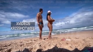 Kristin, a hot wife, wearing a tiny bikini, flaunted herself on a public beach while her husband looked on passively