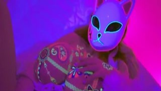 With a neon glow, her massive tits were on display as the masked hottie went wild with solo masturbating while moaning like an anime character