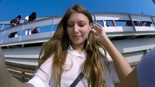 talia mint plays in public with remote control toy over the phone with fan