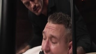 Baxxx is suspended with his legs spread